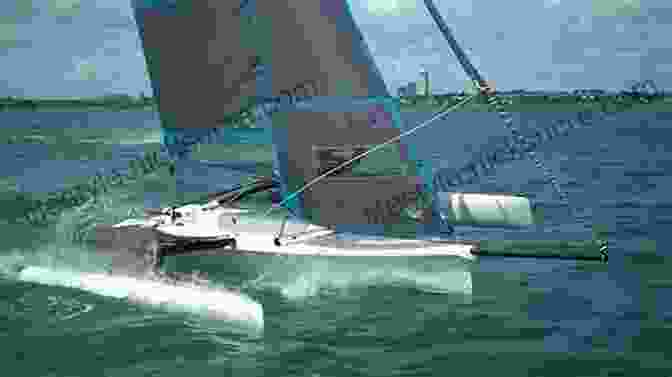 Action Shot Of A Trimaran Slicing Through The Water At High Speed During A Race, Highlighting Its Sleek Design And Exceptional Performance Capabilities. Multihull Seamanship: An A Z Of Skills For Catamarans Trimarans / Cruising Racing (Skipper S Library 3)